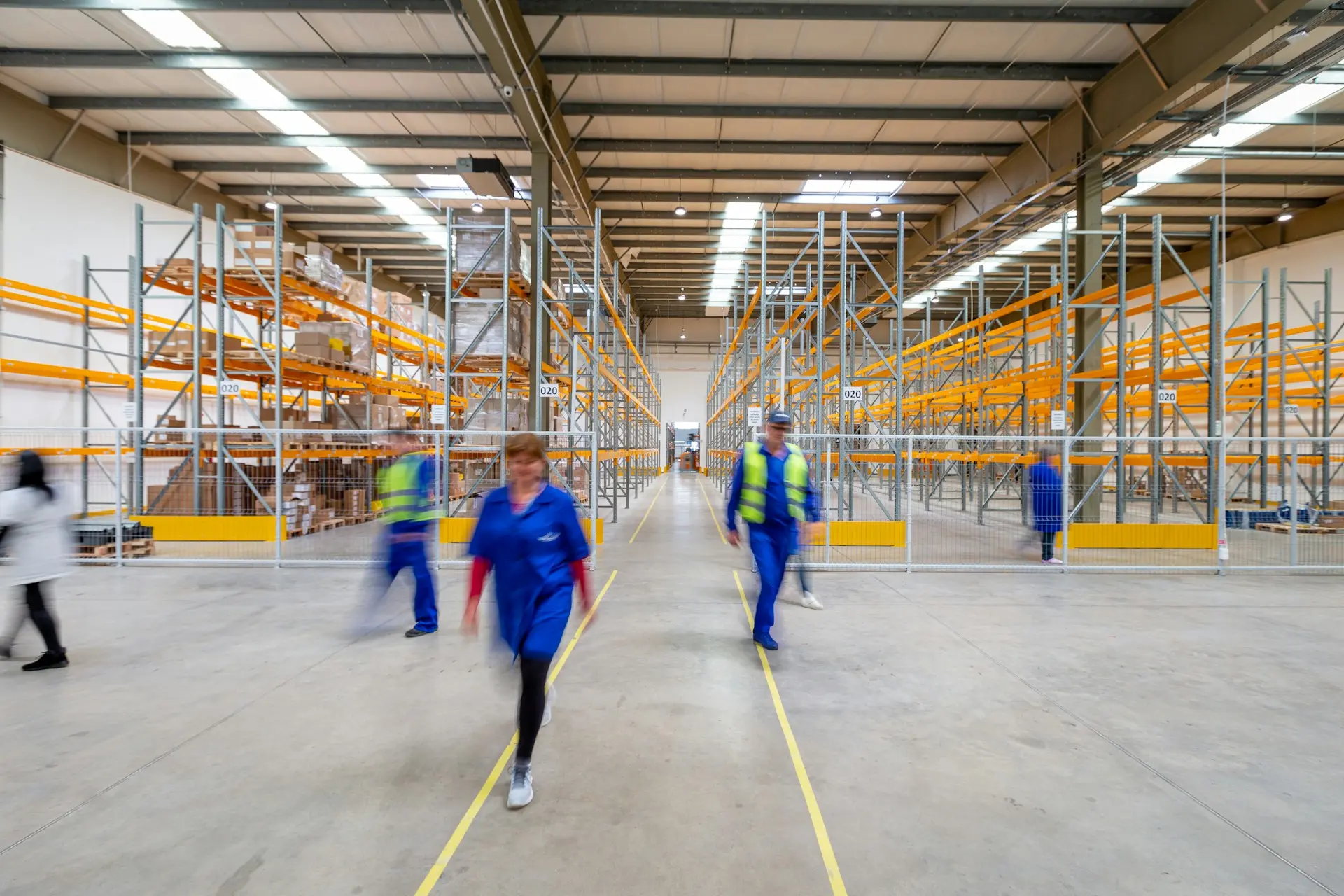 Workers moving around on warehouse